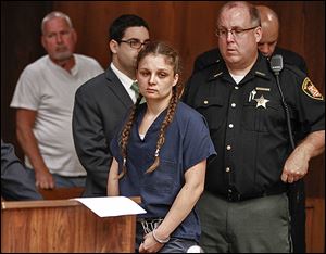 Angela Steinfurth, originally charged with child endangering, ap-pears in court to face an indictment of obstructing justice.  