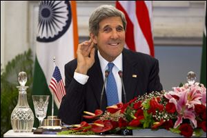 U.S. Secretary of State John Kerry  smiles as he asks a reporter to repeat a question during a news conference  in New Delhi, India today.