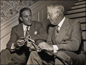 Frank Stranahan chats with his father, R.A. Stranahan, in 1955. R.A. founded Champion Spark Plug with his brother, Frank D. Stranahan.