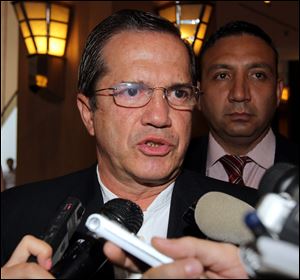 Ecuador's Foreign Mister Ricardo Patino speaks to reporters at a hotel during his visit to Vietnam today.