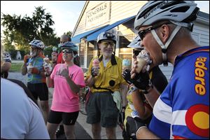 Toledo Area Bicyclists member Brian Gribble, right, and others gather at Generals Ice Cream  stand in Whitehouse, Ohio for a treat after a 20-mile mentoring ride for new members.