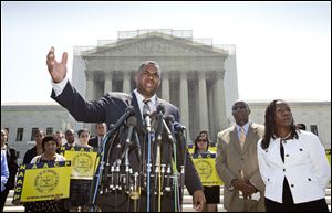 Ryan P. Haygood, director of the NAACP Legal Defense Fund, talks outside the Supreme Court in Washington, today about the Shelby County v. Holder, a voting rights case in Alabama.