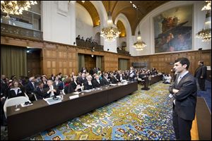 Overview of the courtroom with the Australian delegation, front left, and the Japanese delegation, front right, at the International Court of Justice in The Hague, Netherlands, today.