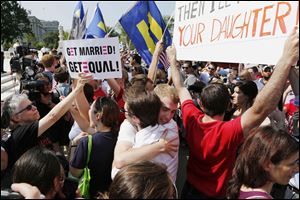 Supporters of gay marriage embrace outside the Supreme Court in Washington after the court cleared the way for same-sex marriage in California.