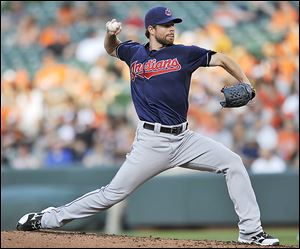 Indians pitcher Corey Kluber delivers against Baltimore in the first inning. Kluber gave up 11 hits and six earned runs in 4 2/3 innings.