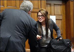 Sam Kaplan, left, attorney for The Blade, and Shannon McAlister, attorney for Michael Fay, speak after a hearing regarding Ms. McAlister's request to bar the media from the Fay youth's court proceedings.