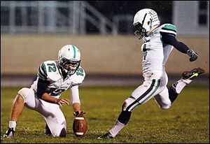 Ottawa Hills' kicker Michael Geiger, right, used kicking camps to help him to be ranked the No. 1 kicking prospect. He will play at Michigan State.