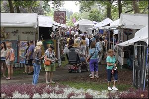 Crowds shop at the Crosby Festival of the Arts at the Toledo Botanical Garden. This year’s festival features 218 artists from the United States and Canada.