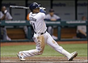 Tampa Bay Rays' Yunel Escobar hits the game-winning RBI single off Detroit Tigers relief pitcher Bruce Rondon.