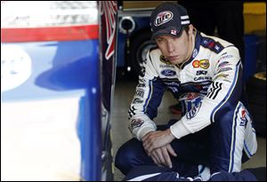 Brad Keselowski sits in the garage between laps during testing at Texas Motor Speedway in Fort Worth,Texas.