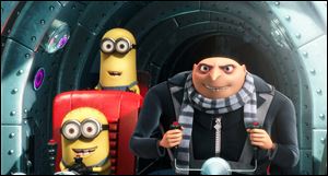 Gru, voiced by Steve Carell, is shown with two of his minions in a scene from the 3-D CGI feature, 