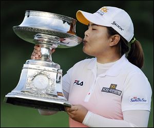 Inbee Park kisses the trophy after winning the LPGA Championship tournament this season. It is one of three majors the South Korean has captured in a year that has five majors.