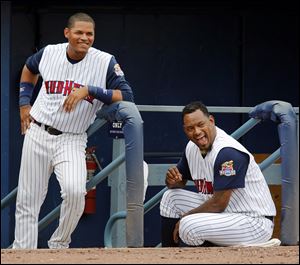 Jose Valverde, right, and Argenis Diaz watch the game on Wednesday. The 35-year-old Valverde joined the Hens on Monday and hopes to improve enough to get called back up to the Tigers.