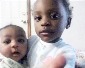 Keondra Hooks, 1, left, was killed during an Aug. 9 shooting while her 2-year-old sister, Leondra Hooks, was seriously injured. Keondra died about 12 hours after the shooting.