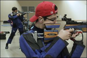 Tyler Thompson, 15, of Graytown, left, and Sean Roehrs, 15, of Sylvania practice shooting at Camp Perry. The team shoots air rifles in two categories.