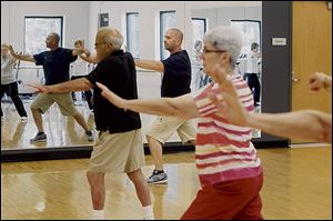 Instructor Joe Gray, center, leads a Tai Chi class at Francis Family YMCA in Temperance.
