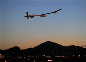 The Solar Impulse, piloted by André Borschberg, taking flight, at dawn, from Sky Harbor International Airport in Phoenix, May 22.