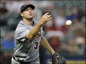 Detroit's Max Scherzer tosses to first to get Cleveland's Mike Aviles on a ground out in the third inning. Scherzer allowed two runs on seven hits in seven innings.