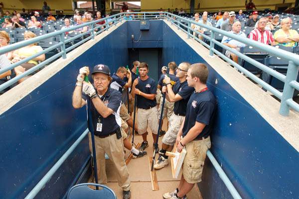 The-grounds-crew-wait-in-the-umpire-tunnel-to-drag-the