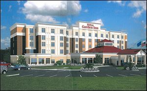 An artist rendering shows the planned Hilton Garden Inn in Findlay as a five-story structure near I-75 and U.S. 224.