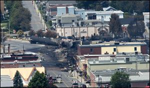 Damage in the downtown of Lac Megantic, Quebec is seen Sunday, July 7, 2013, the day after a train derailed causing explosions of railway cars carrying crude oil. (AP Photo/The Canadian Press, Paul Chiasson)