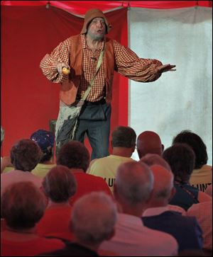 Hank Fincken performs as Johnny Appleseed during the OHIO Chautauqua event at Veteran's Park in Rossford, Ohio.