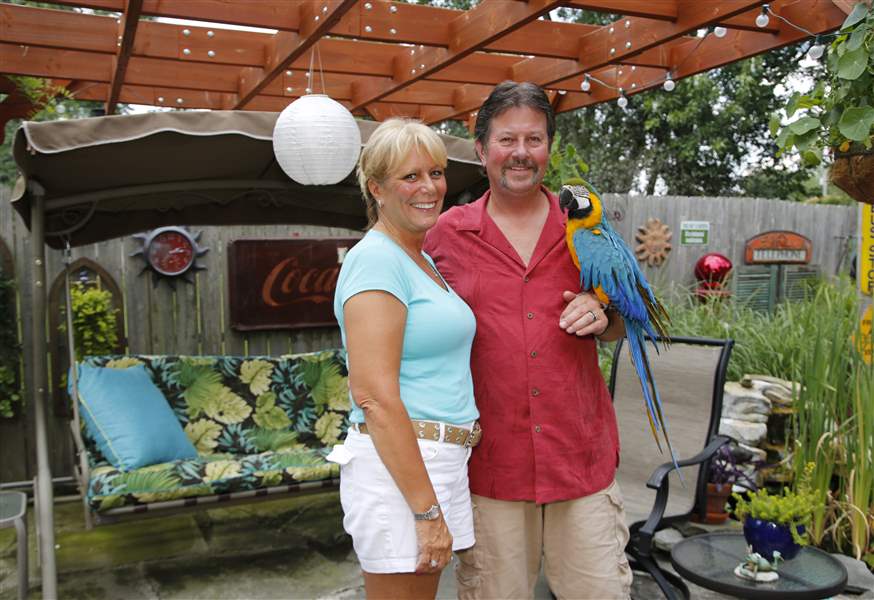 Tammy-and-Greg-Wheeler-in-their-Caribbean-themed-backyard