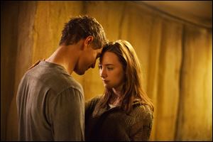 Max Irons, left, and Saoirse Ronan in a scene from 'The Host.'
