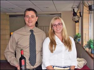 Jeffrey Ienna from Heidelberg Distributing Co. with Rachael Garvin, Toledo Yacht Club's summer intern, at the club's wine tasting party.