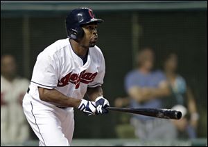 Cleveland Indians' Michael Bourn doubles to drive home two runs in the seventh inning against the Kansas City Royals.