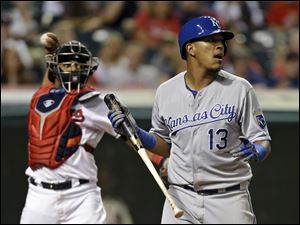 Kansas City Royals' Salvador Perez (13) reacts after striking out against Cleveland Indians relief pitcher Cody Allen in the ninth inning.