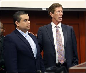 George Zimmerman, left,  stands in the courtroom with defense counsel Mark O'Mara during closing arguments in his trial at the Seminole County Criminal Justice Center, in Sanford, Fla., Friday.