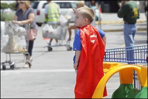 CJ Campbell, 4, of Holland came prepared to do super-hero work Sunday at the Air Dogs competition.