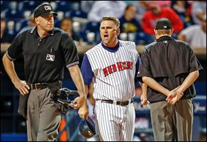 Toledo Mud Hens manager Phil Nevin argues with home plate umpire Jon Saphire during the ninth inning of a game against Lehigh Valley last month. Nevin was ejected from the game.