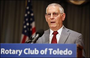 J. Winston Porter, an assistant administrator with the EPA during the Reagan years, said regulators should move slowly on global warming. He spoke to the Toledo Rotary Club on Monday. 