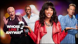 Aisha Tyler, front, succeeds Drew Carey as host of the new installment of 'Whose Line Is It Anyway,' on The CW network. Returning as improv performers will be, back from left, Colin Mochrie, Wayne Brady, and Ryan Stiles.