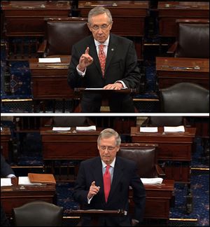 Senate Majority Leader Harry Reid, D-Nev., top, and Republican leader, Sen. Mitch McConnell, R-Ky., speak on the floor of the Senate on Capitol Hill in Washington in June.