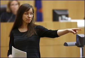 Jodi Arias points to her family as a reason for the jury to give her a life in prison sentence instead of the death penalty, during the penalty phase of her murder trial at Maricopa County Superior Court in Phoenix.
