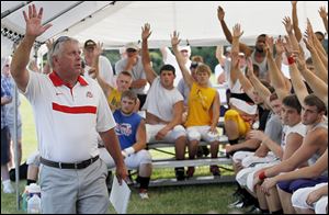 Ohio State assistant football coach Tim Hinton addressed a group of recently graduated high school football players at Steinecker Stadium in Perrysburg.
