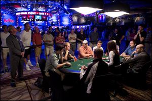 Eight of 25 remaining players engage in a round of Texas Hold 'em during the World Series of Poker, Monday in Las Vegas. 