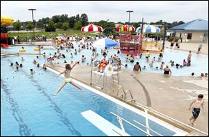 Maumee’s Rolf Park Pool is packed with swimmers trying to beat the heat Tuesday, when local high readings hovered around 90 and 91. Last year at this time, Toledo already had four 100-degree days. 