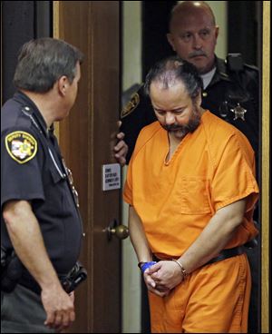 Ariel Castro is led into Cuyahoga County Common Pleas Court in Cleveland for a pretrial hearing earlier this month.