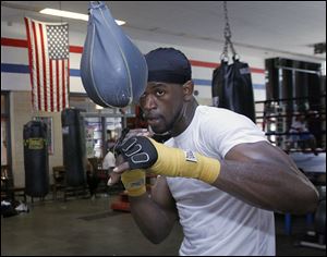 Boxer and former gang member Paul Parker works out at the Glass City Boxing gym in Toledo.