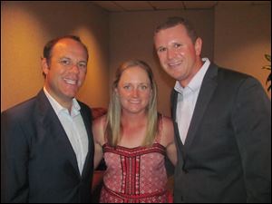 Former Toledoan and LPGA golfer Stacy Lewis, center, along with her boyfriend Stephen Cornillie, right, chat with gala entertainer, comedian Tom Papa, left.