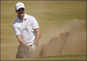 Zach Johnson opened with a 6-under 66 on a sunny day today at Muirfield — another brilliant opening after a 65 at Lytham last year.