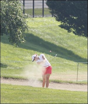 Paula Creamer hits out of a bunker on the fairway of the ninth hole in the second round of the Marathon Classic today.