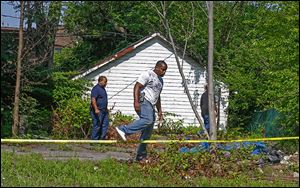 East Cleveland police search near where the bodies of three women were found. The search ended Sunday without finding more. It is not expected to resume today. A 35-year-old registered sex offender is in custody.