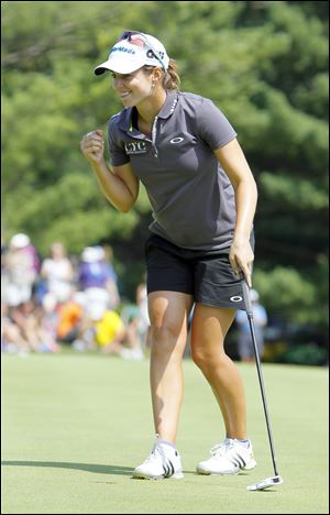 Beatriz Recari pumps her fist after making par on the 18th hole to clinch the Marathon Classic.