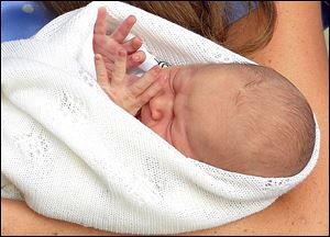 Kate, the Duchess of Cambridge, carries her new born son, the Prince of Cambridge, who was born today.