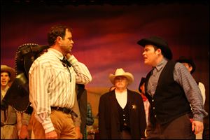 From left, Matt Richardson as Curly, Wally Snyder as Cord Elam, and Jared Murray as Jud rehearse a scene in the Maumee Valley Civic Theatre production of 'Oklahoma!'